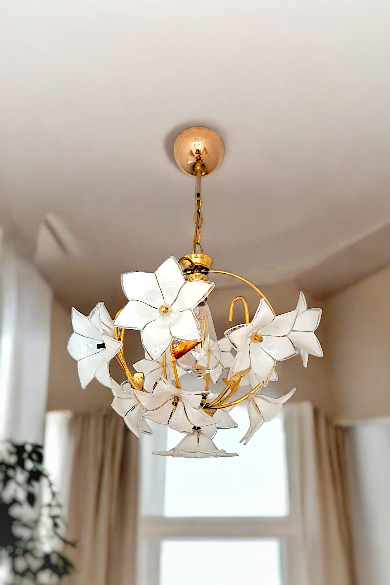 Handcrafted vintage-style brass chandelier featuring delicate glass flowers